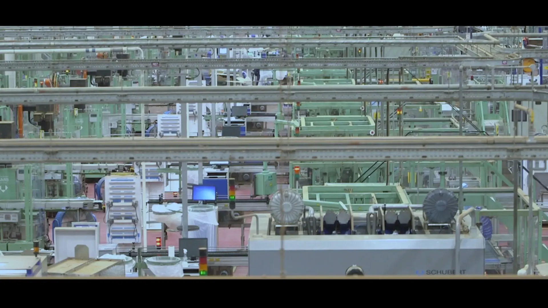 Human Machine documentary still showing an industrial interior without visible faces
